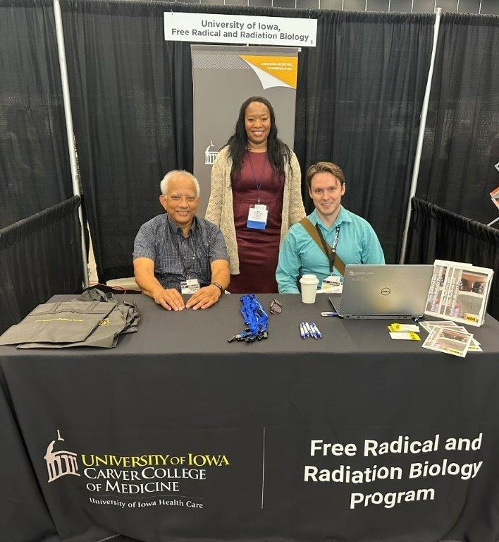 Dr. Andrean Simons-Burnett (middle) Dr. Prabhat Goswami (left), and Dr. Shane Solst (right) representing the University of Iowa Free Radical and Radiation Biology Program at ICRR